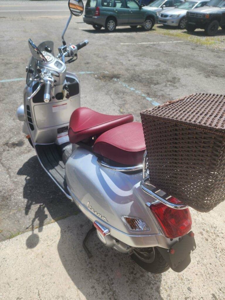 Vespa scooter with red seat